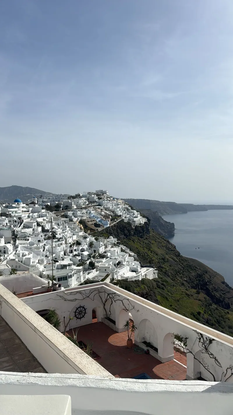 The caldera seen from a terrace in Oia at golden hour