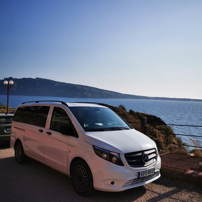 The white Mercedes-Benz Vito at a caldera viewpoint, ready for the next transfer